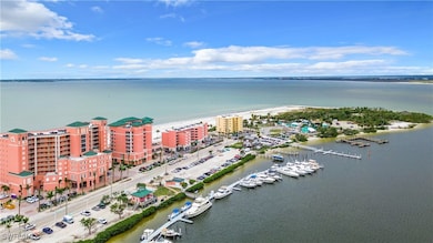 Aerial view of apartment complex / building and a large body of water