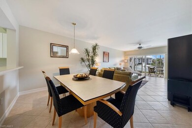 Dining room featuring light tile patterned floorin