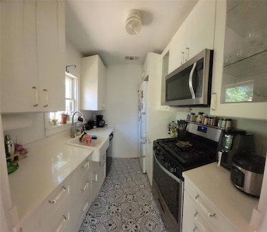Kitchen featuring appliances with stainless steel