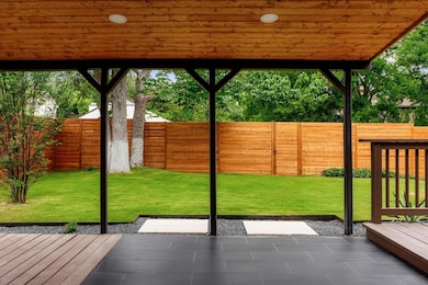 Doorway to outside featuring wooden ceiling