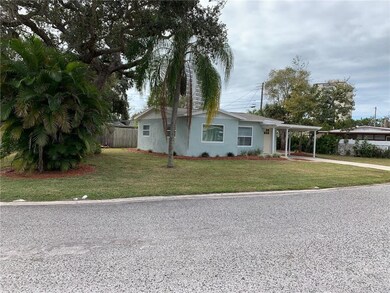 Side of house with nice Oak shade tree.