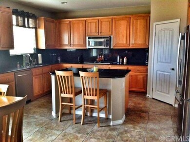 Open Kitchen with Granite and Maple Cabinets