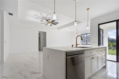 Kitchen with a sink, stainless steel dishwasher, o