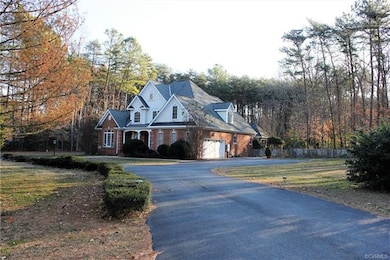 Circular drive with parking next to the attached garage and your detached garage.