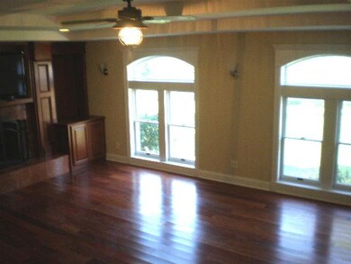 Living Room. The arch top windows over look the go