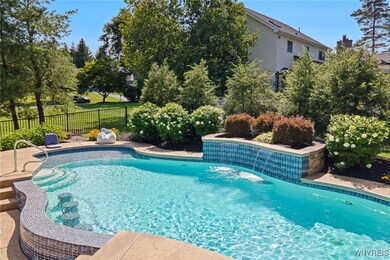 Gorgeous Pool w/ waterfall & built-in seating