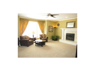 Family Room with Wall of Windows Overlooking Deck
