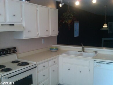 Kitchen - Kitchen with pass-through window to dini