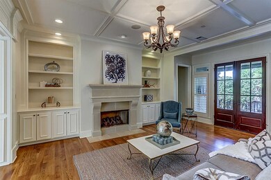 Lovely stylish formal living room.  Transom window