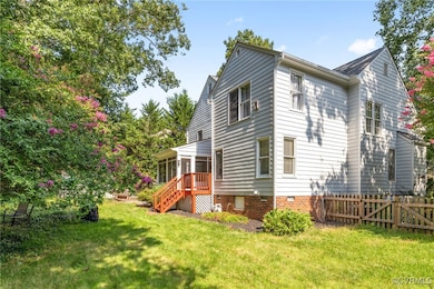 Rear view of property featuring a lawn