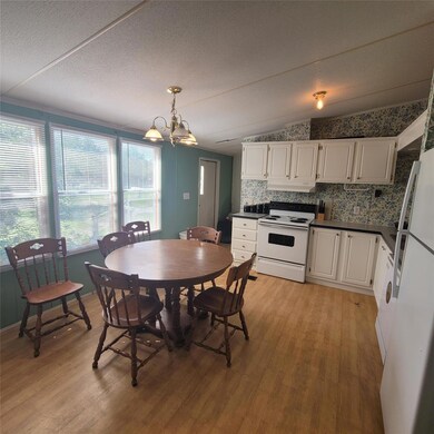 Kitchen with white appliances, under cabinet rang