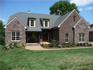 Awesome elevation with brick, stone and cedar columns & trim.