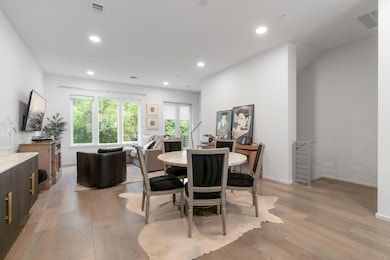 Dining room featuring light wood-style floors, re