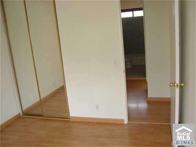 3rd Bedroom with Mirrored Wardrobe Doors & Laminat