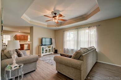 Living area has beautiful ceiling treatment and ce