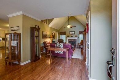 Entry foyer with hardwood floors looks directly into great room.