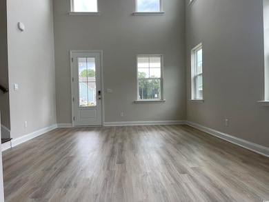 Entrance foyer with light hardwood / wood-style fl