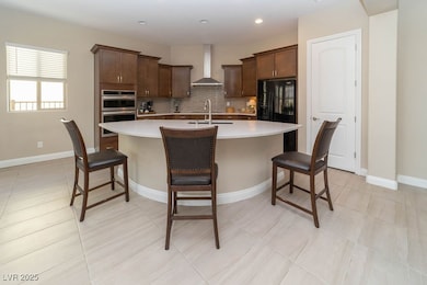 Kitchen with tasteful backsplash, a center island