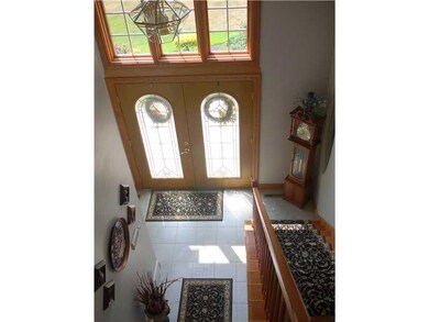 Entry/Foyer. Stunning Foyer, Brand new custom ceramic tile Solid Oak throughout, brass carpet rods for that extra special sparkle..  Leaded Glass Doors Welcome you Home!