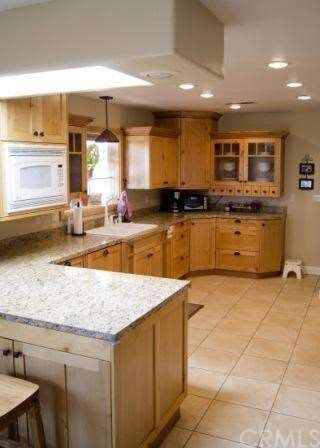 Light and bright kitchen area with skylight.