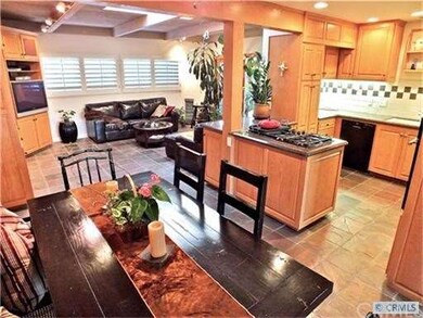 The fully upgraded, efficient kitchen opens to an 