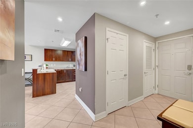 Kitchen with light tile patterned flooring, light
