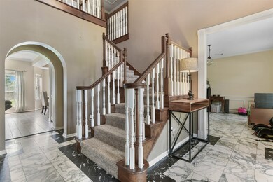 2 story entry with marble flooring