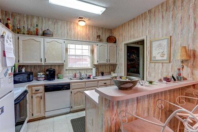 Kitchen has lots cabinets! Eat-in kitchen, and bre