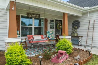 Entrance to property featuring covered porch