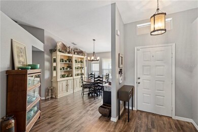 View of entry with upgraded fixtures and wood lami