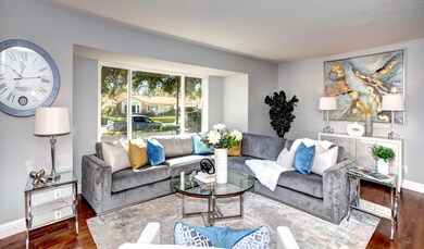 Spacious living room with bay window.