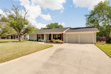 Ranch-style house with fence, a front lawn, brick
