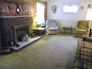 The Living Room is large with a woodburning firepl