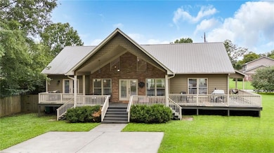 View of front of property with a deck and a front 