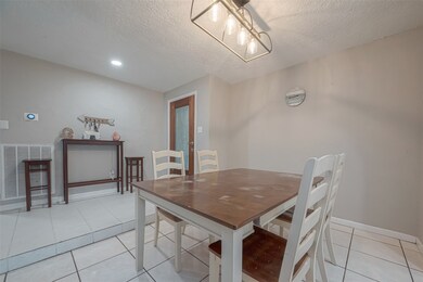 Entering the home you are greeted by the dining area. This dedicated dining area seamlessly combines style, functionality, and comfort, making it the perfect place for daily meals, intimate gatherings, and memorable celebrations.