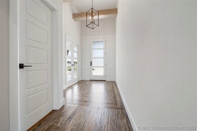 Entry with wood inlay. Hand scraped hardwood floor