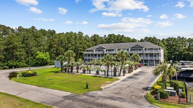 View of front of house featuring an outdoor pool