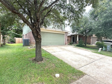Obstructed view of property featuring brick sidin