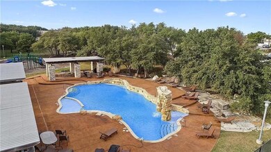 Community pool with a gazebo, a patio area, and v
