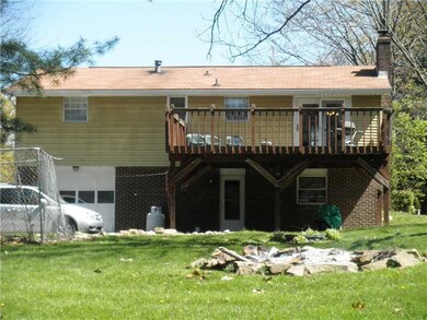 Exterior Back. Rear of home with fire pit. Walk ou