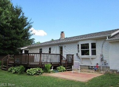 Nice deck with two stairs. One to the backyard and