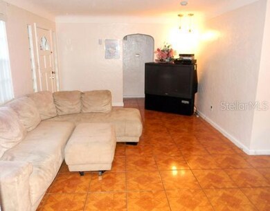 Living Room - Light and bright with tile floors.