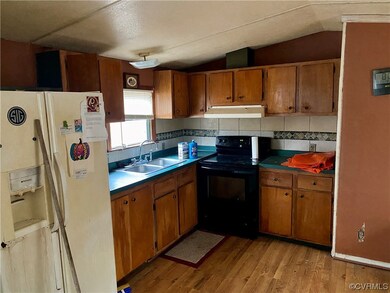 Kitchen featuring sink, light hardwood / wood-styl