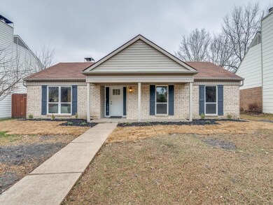 View of front of house with covered porch and a fr