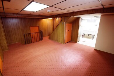 Game Room leads to the Laundry Room and Garage wit