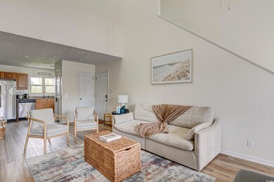 Living area featuring light wood-style flooring, b