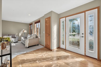Glass door and sidelights make for a sun-filled entrance.