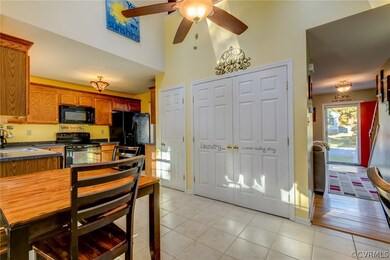 Rear view of eat-in area, laundry closet, and pant