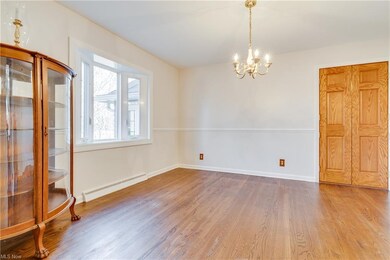 Formal dining room with hardwood floors and bayed 