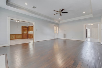 The kitchen and family room open effortlessly into one another, creating a harmonious flow that invites connection and conversation.